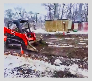 A track loader preparing a cross-docking site.